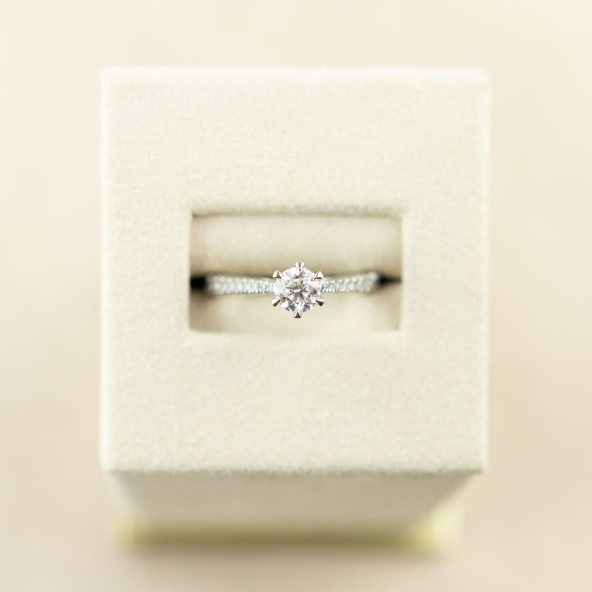 Platinum 0.50ct GIA certificated 6 claw solitaire ring with diamond set shoulders