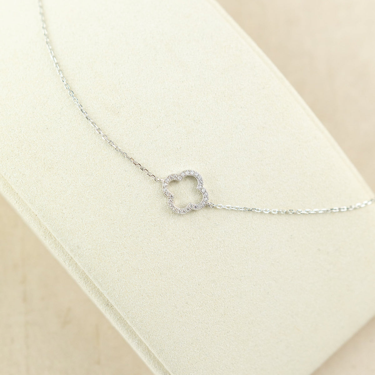 Designer inspired silver rhodium plated cz single open clover bracelet