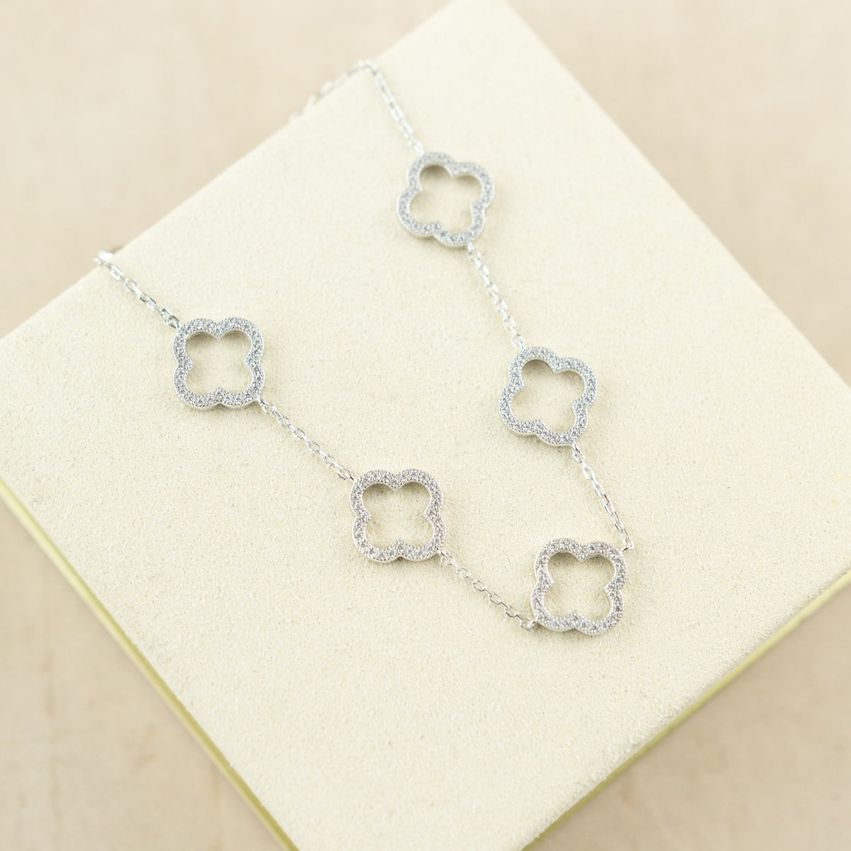 Designer inspired silver rhodium plated 5 cz open clover bracelet