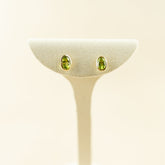 9 Karat Yellow Gold Smooth Bevel Oval Peridot Studs