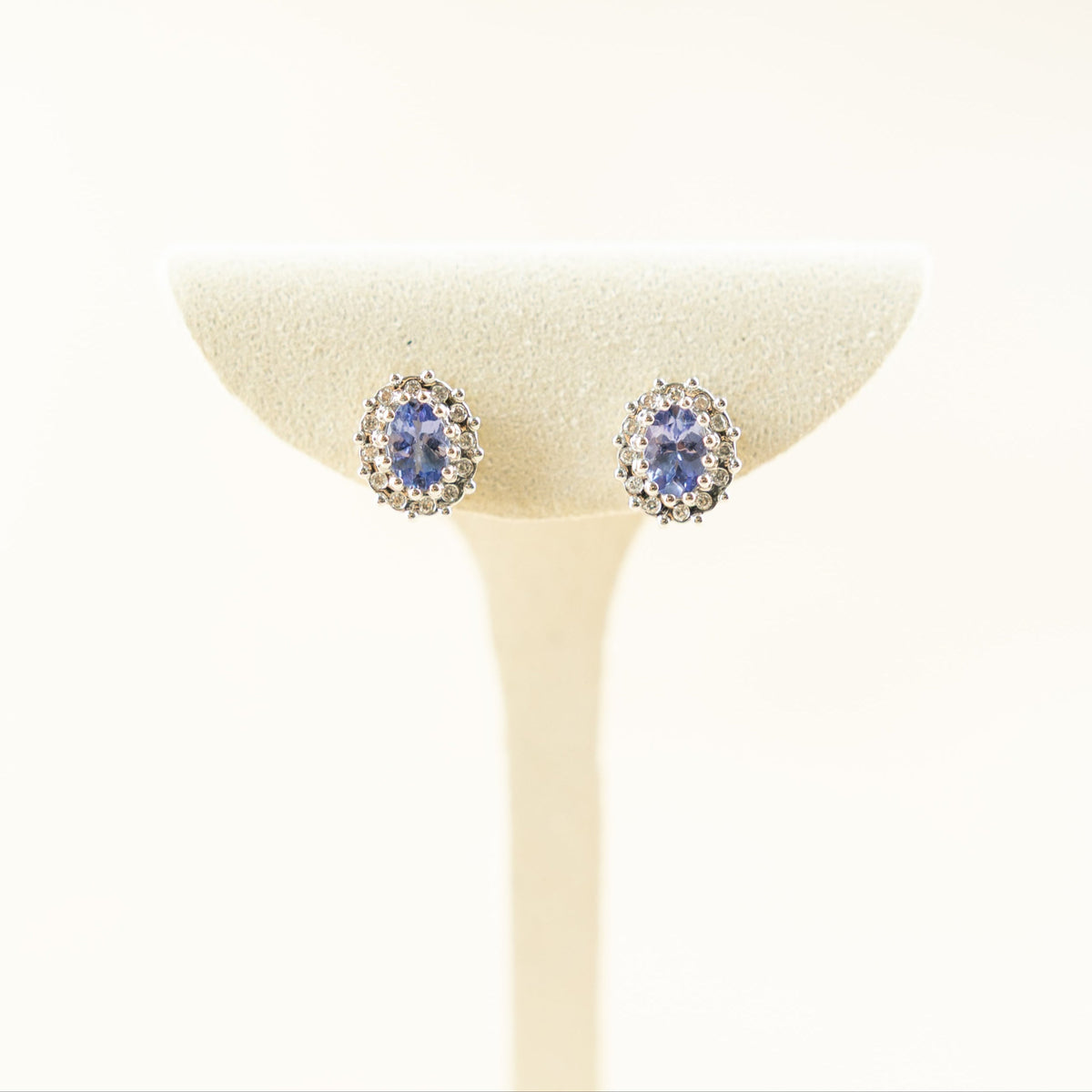9 Karat Yellow Gold Tanzanite Earrings with Diamond Halo