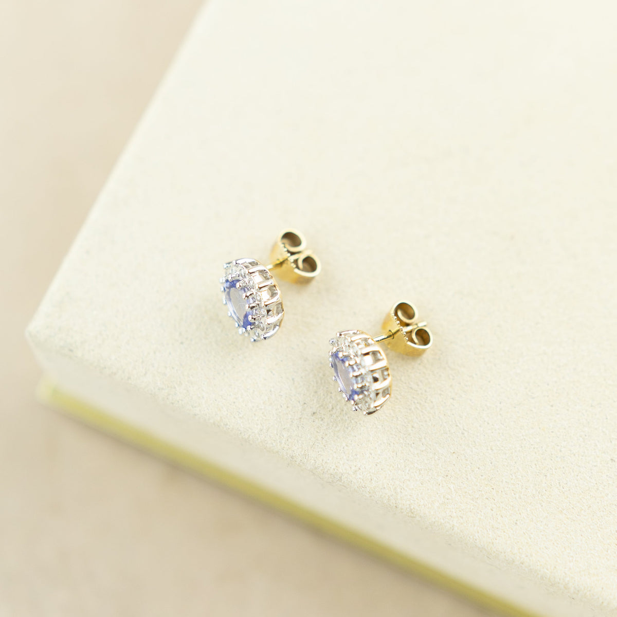9 Karat Yellow Gold Tanzanite Earrings with Diamond Halo