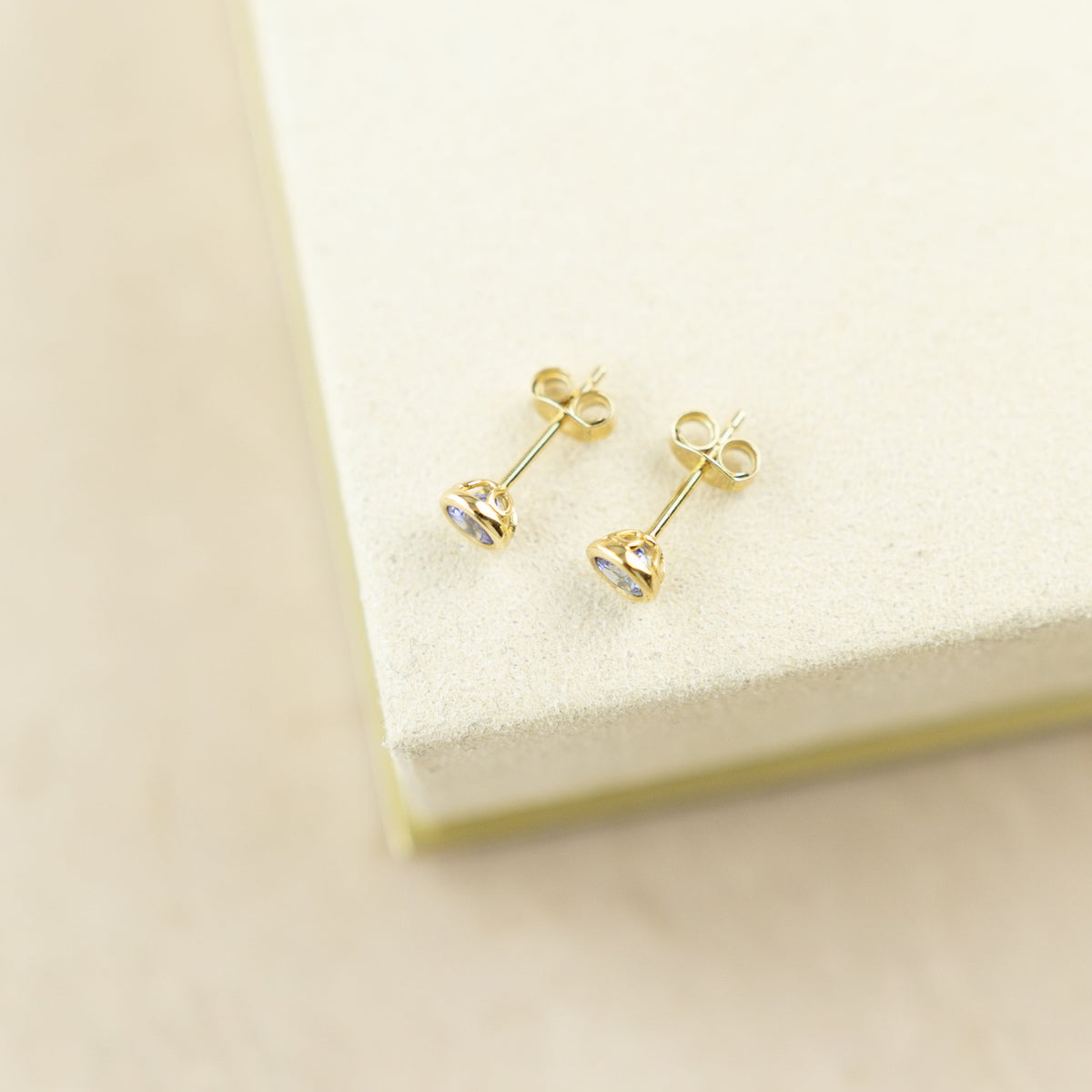 9 Karat Yellow Gold Smooth Bevel Tanzanite Studs at RR Jewellers Yarm UK