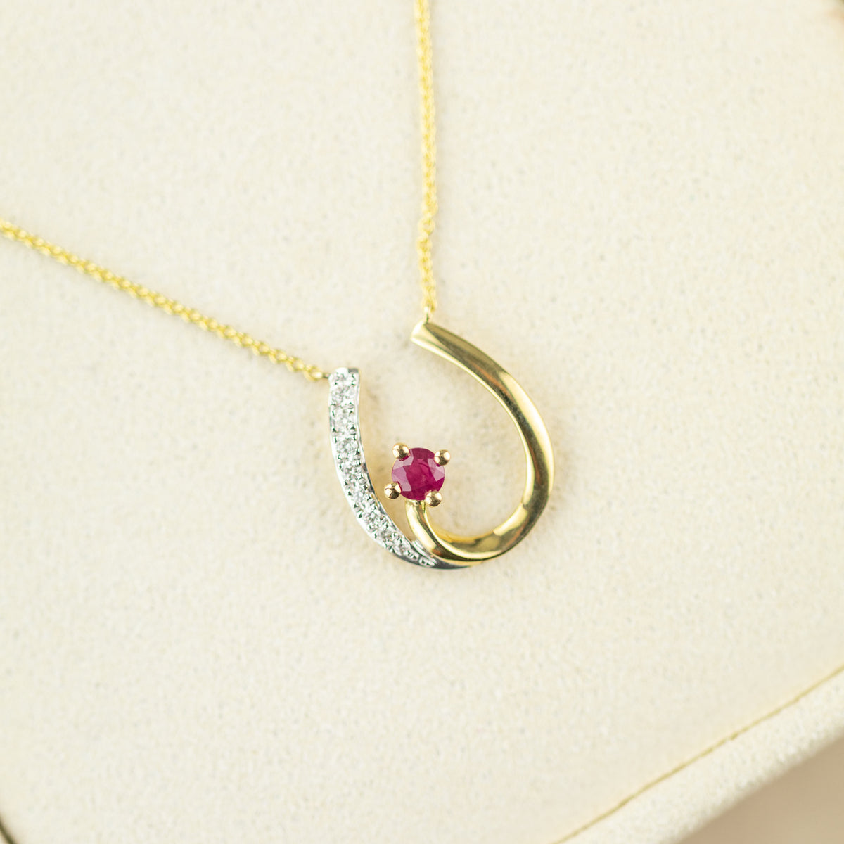 9 Karat Yellow Gold Ruby & Diamond Horse Shoe Pendant
