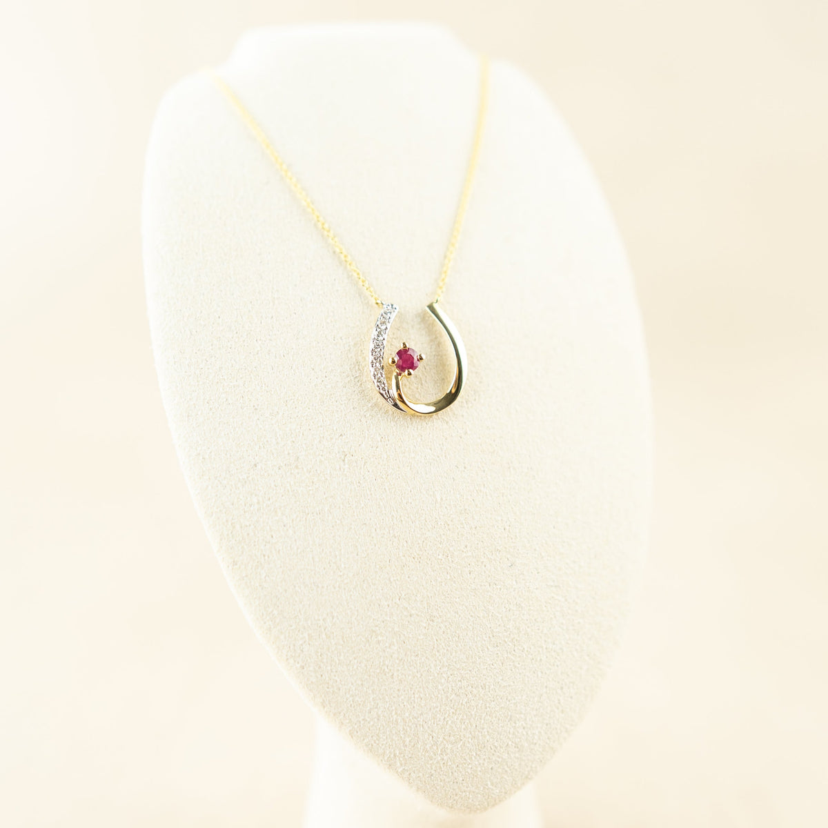 9 Karat Yellow Gold Ruby & Diamond Horse Shoe Pendant