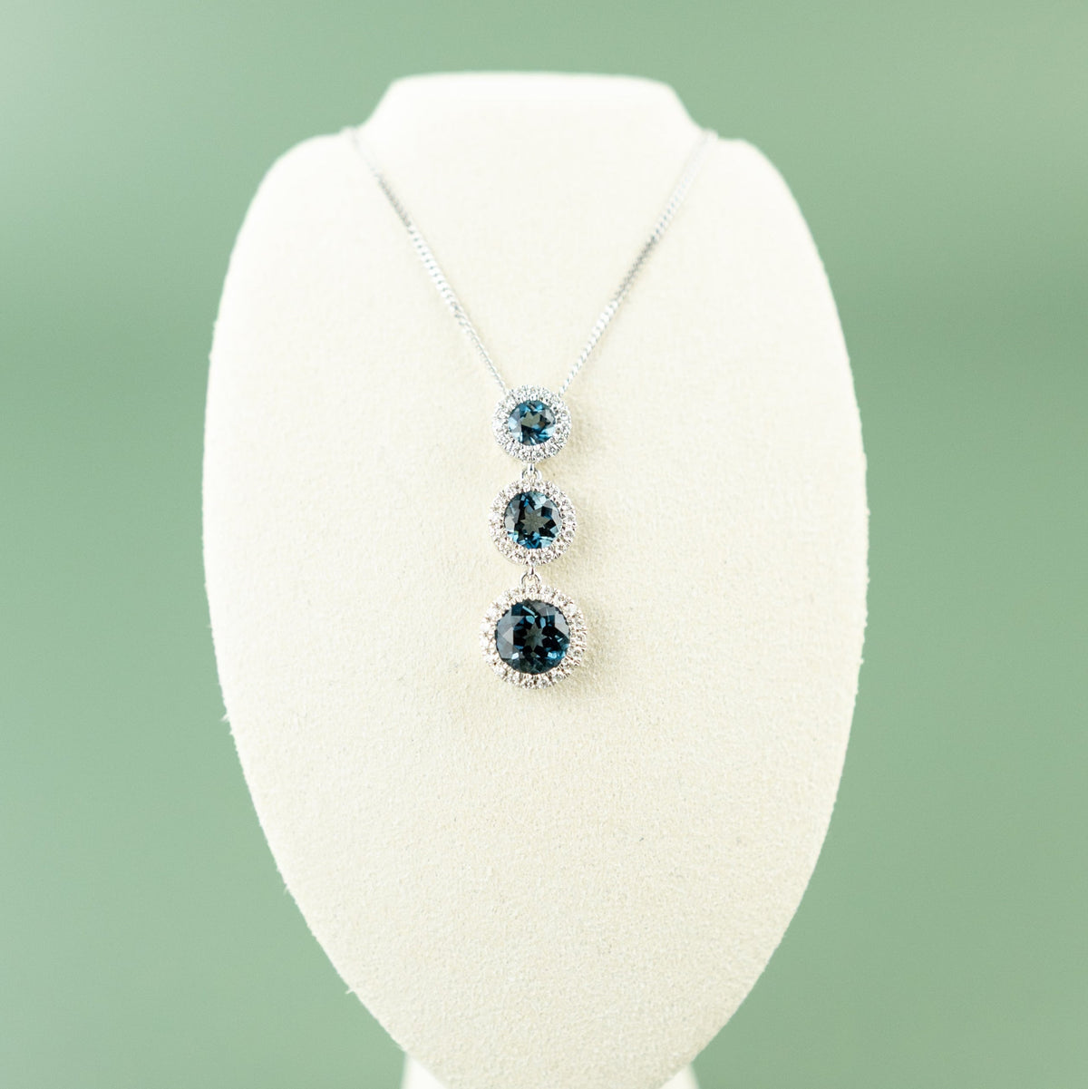 9 Karat White Gold London Blue Drop Halo Pendant