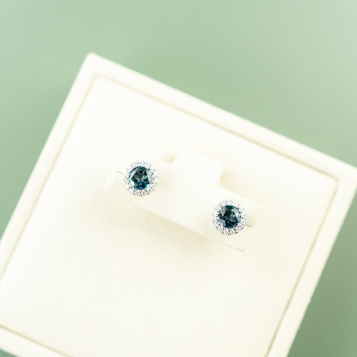 9 Karat White Gold London Blue Topaz Halo Studs 0.18ct
