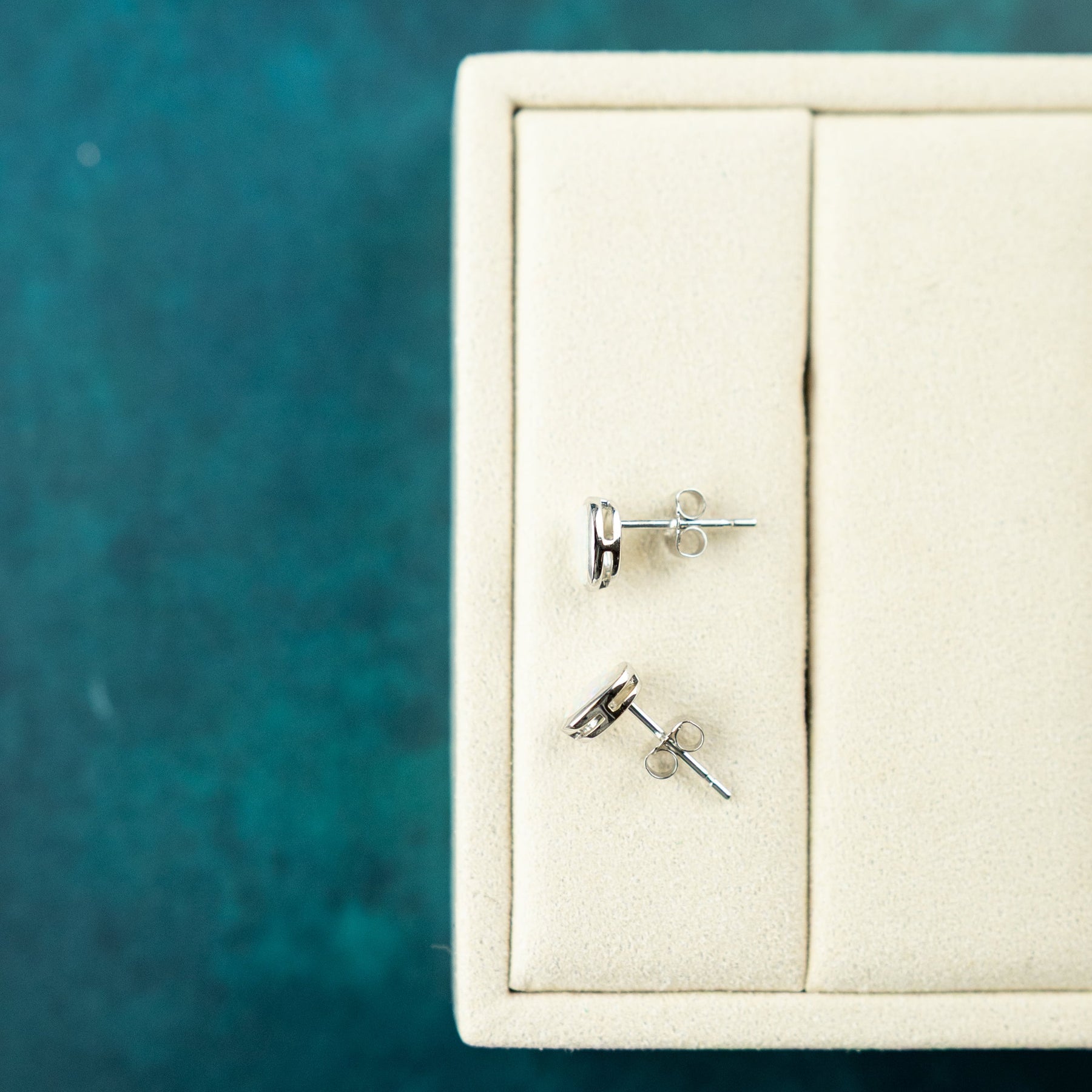 9 Karat White Gold Opal Rub Over Studs