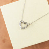 18 Karat White Gold Diamond Baguette Set Heart Pendant