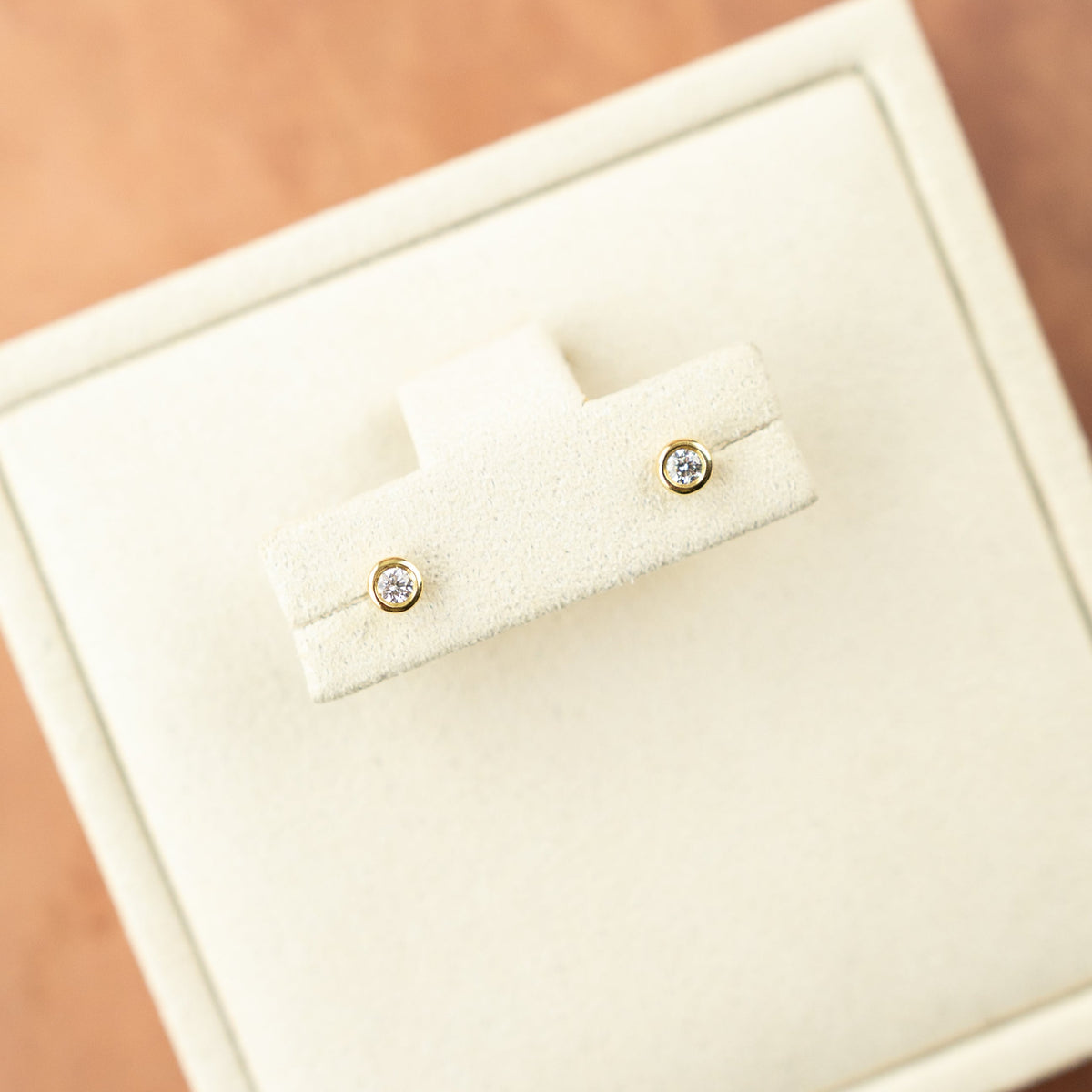 18 Karat Yellow Gold Bezel Set Diamond Earrings 0.10ct