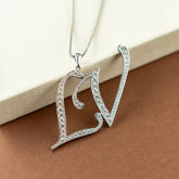 Pre - Loved 18 Karat White Gold LV Diamond Initial Pendant