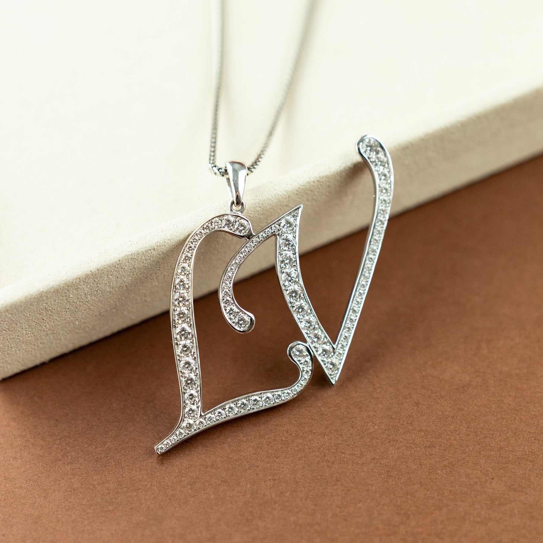 Pre - Loved 18 Karat White Gold LV Diamond Initial Pendant