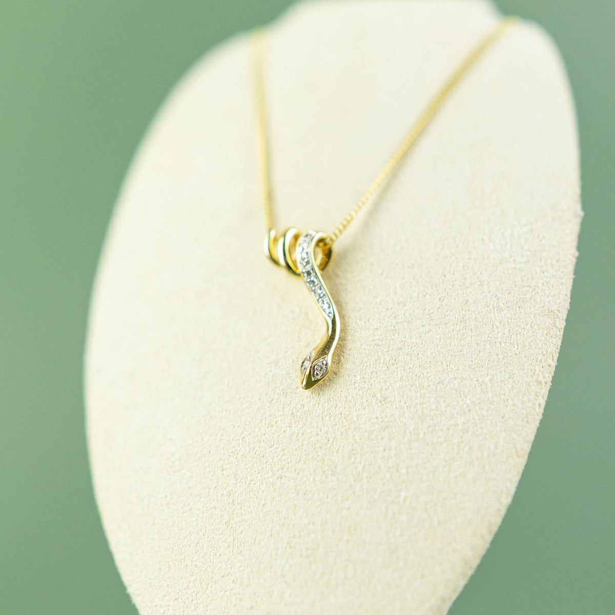 9ct yellow gold diamond set snake loop pendant