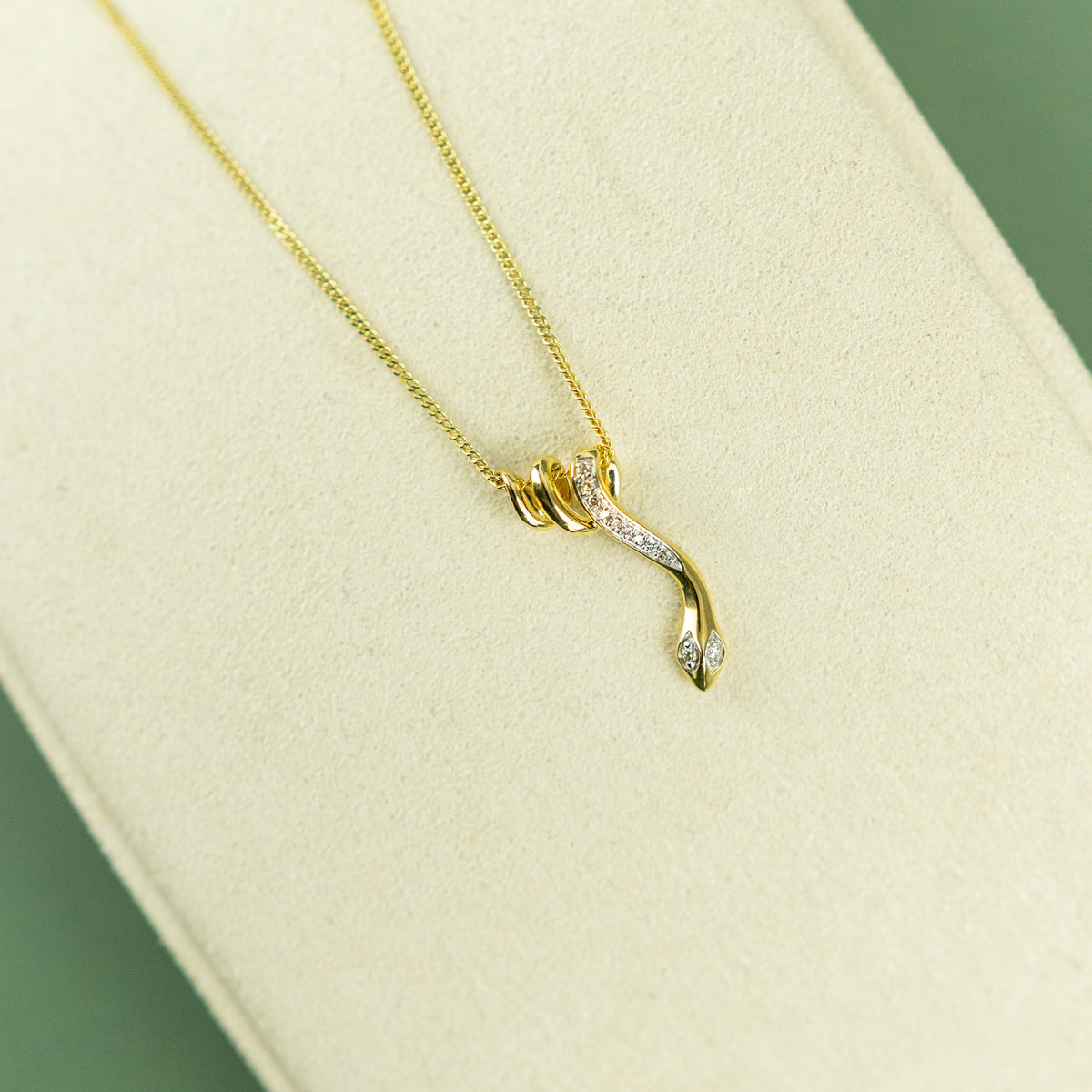 9ct yellow gold diamond set snake loop pendant