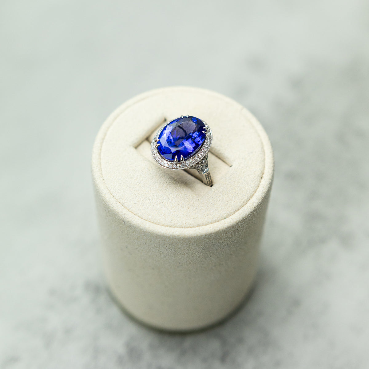 18ct White Gold Oval Tanzanite Halo Ring With Diamond Set Band