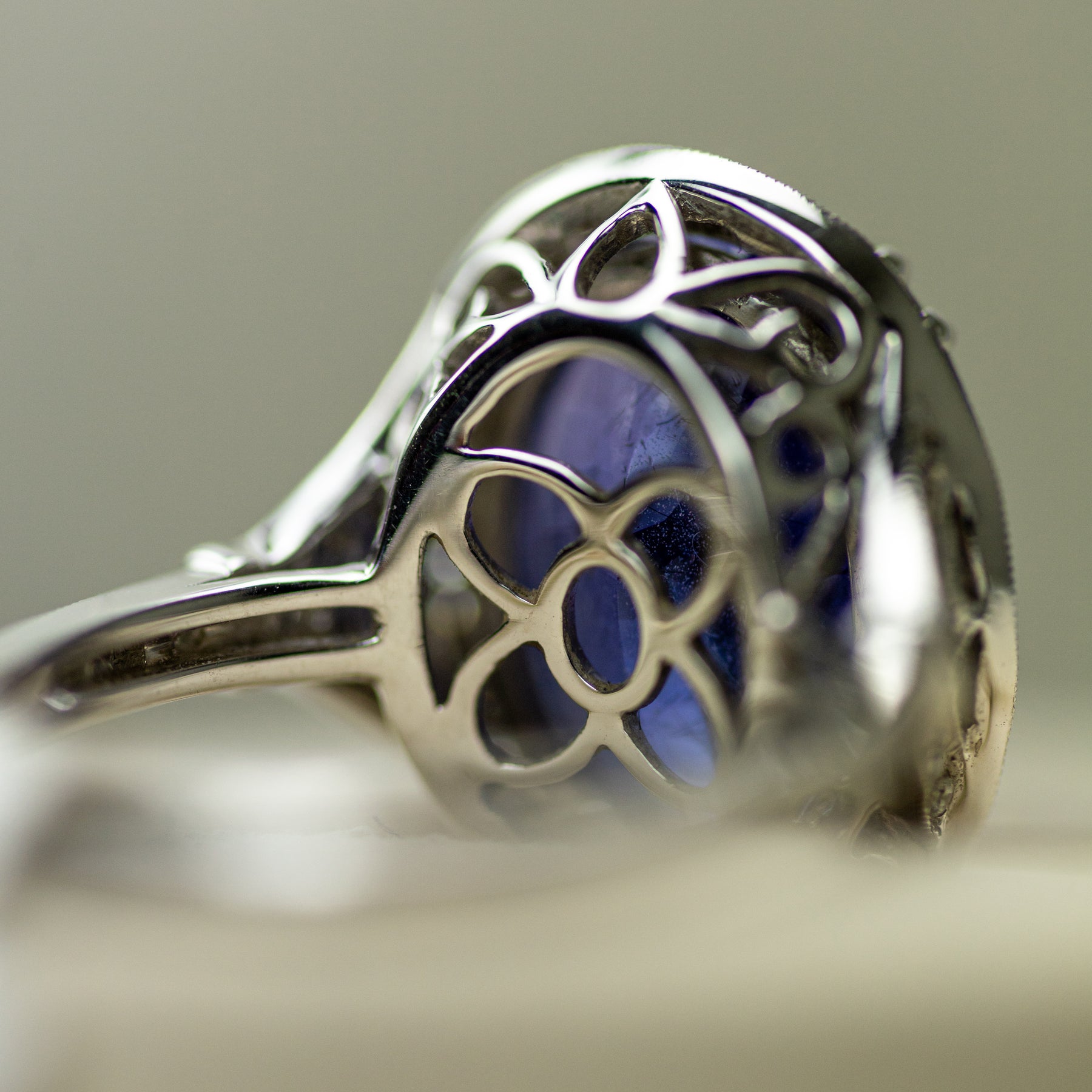 18ct White Gold Oval Tanzanite Halo Ring With Diamond Set Band