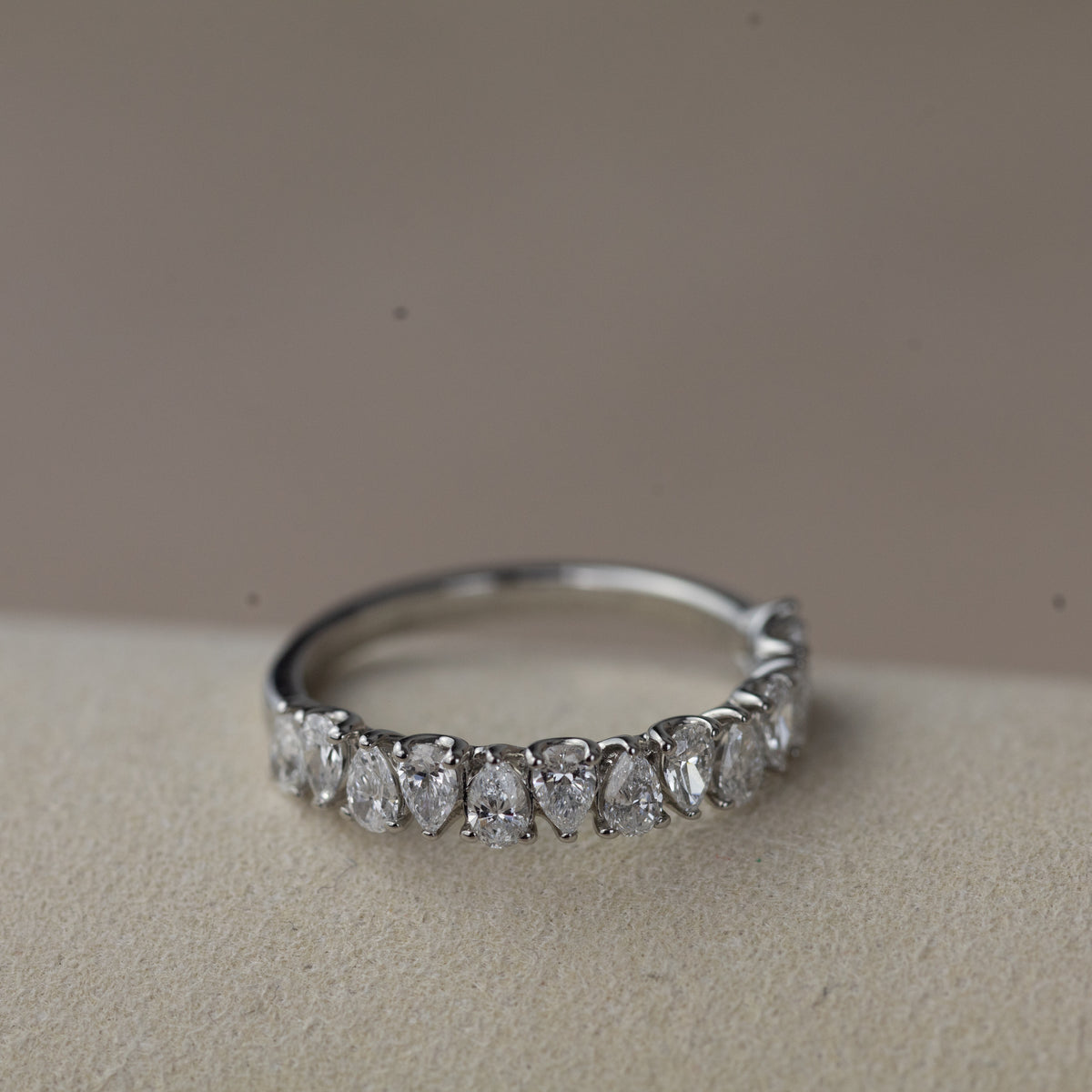Platinum pear cut claw set eternity ring