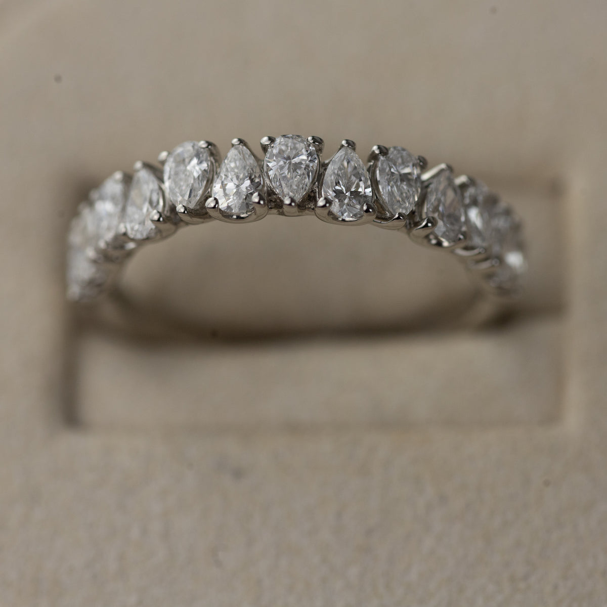 Platinum pear cut claw set eternity ring