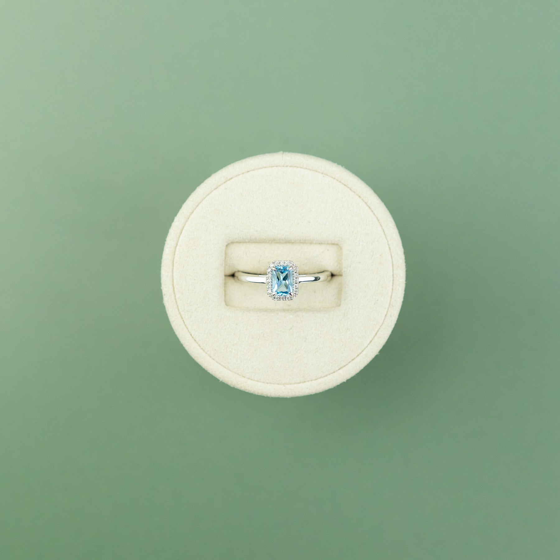 18 Karat White Gold Blue Topaz Emerald Cut Halo Ring