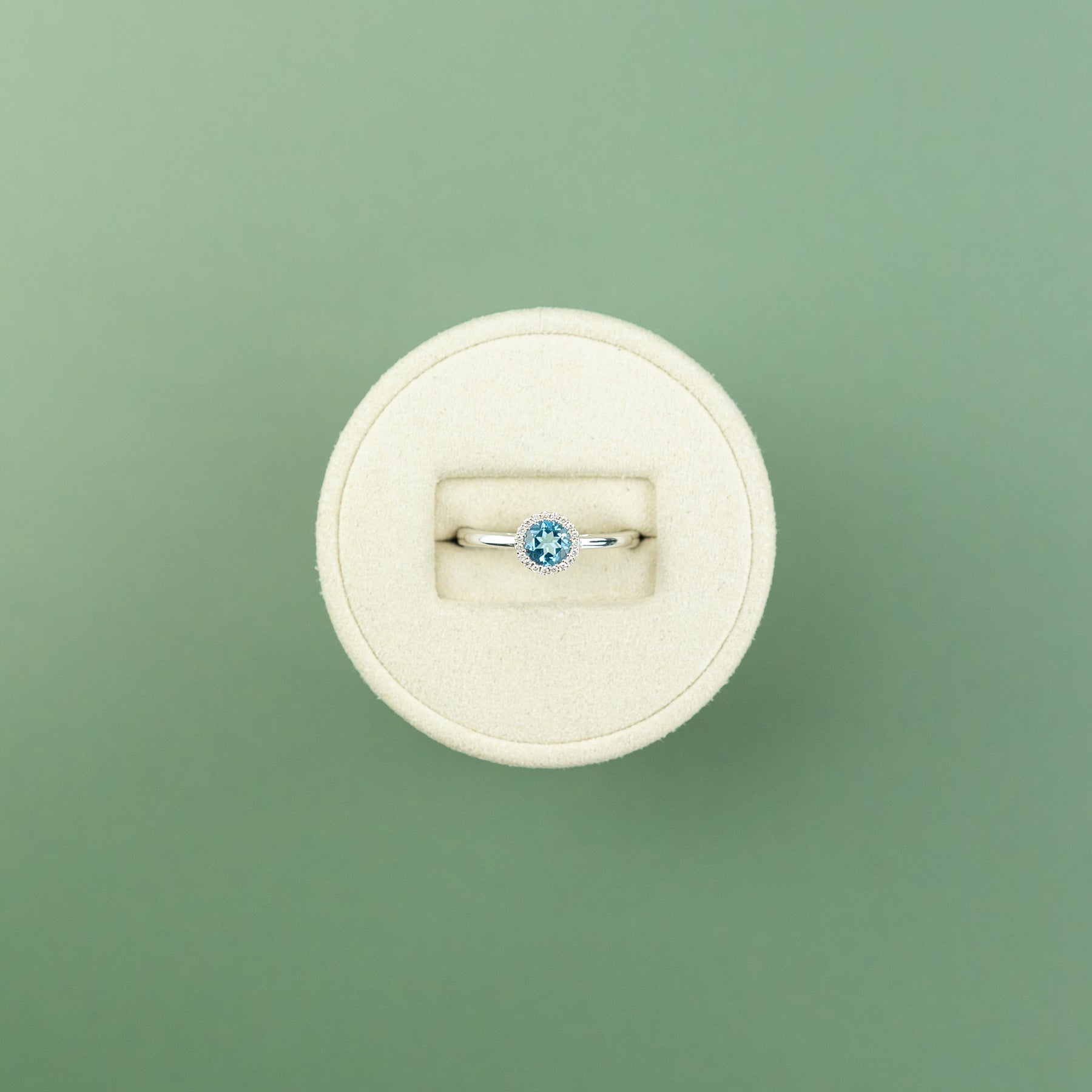 18 Karat White Gold Blue Topaz Round Halo Ring 0.56ct at RR Jewellers Yarm UK