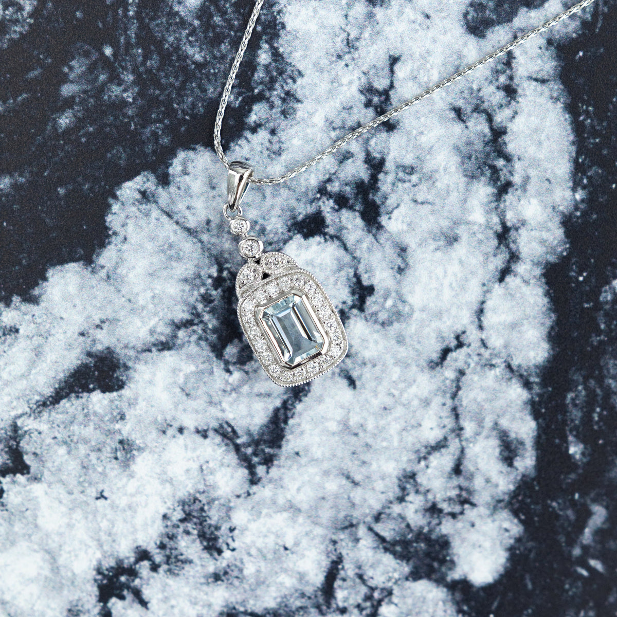 18ct White Gold Emerald Cut Aquamarine & Diamond Halo Pendant