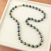Black Rice Pearl Necklace with 9 Karat Yellow Gold Bead & Clasp