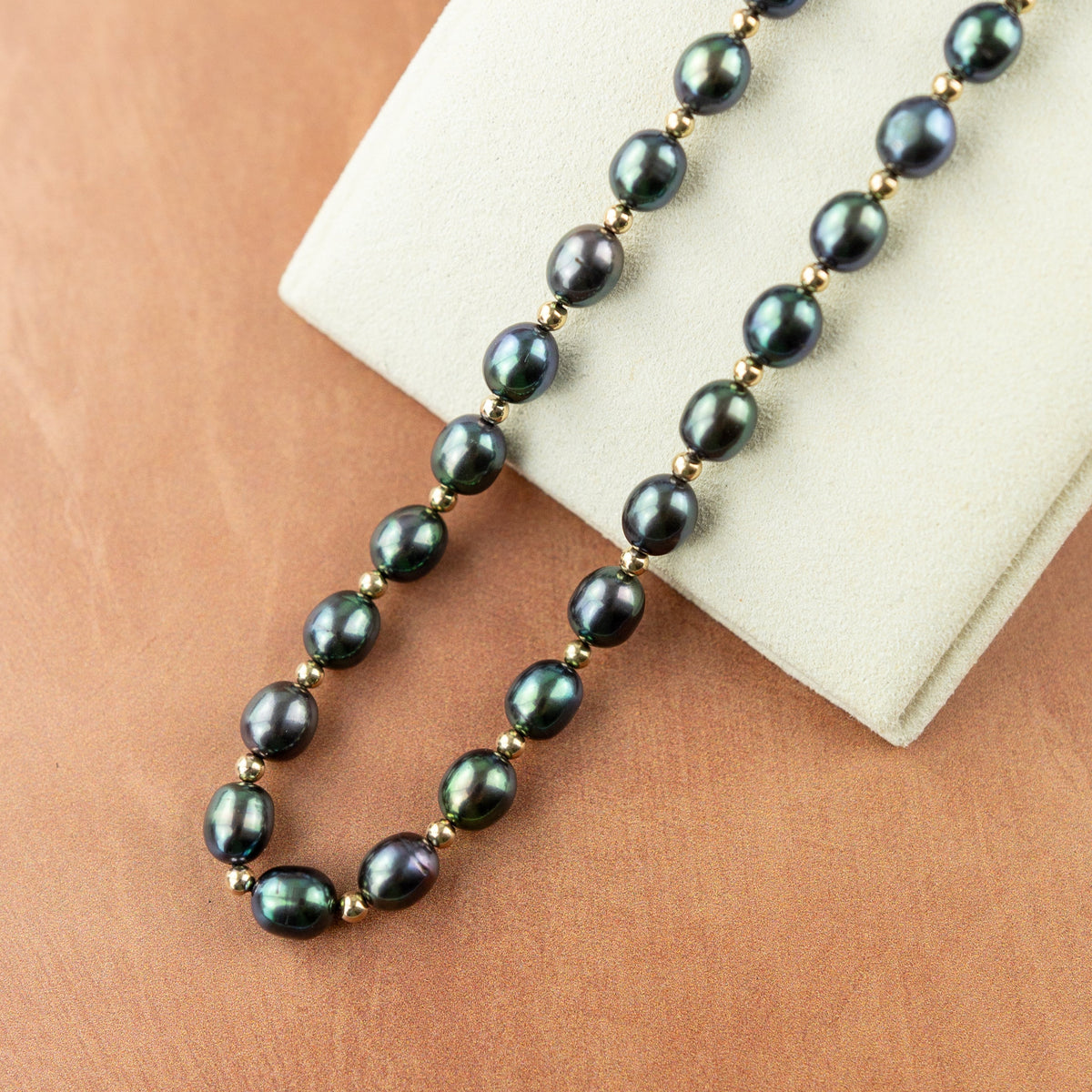 Black Rice Pearl Necklace with 9 Karat Yellow Gold Bead & Clasp