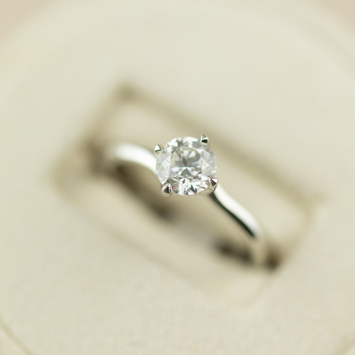 Platinum round brilliant 0.90ct GIA diamond 4 claw twist set solitaire ring