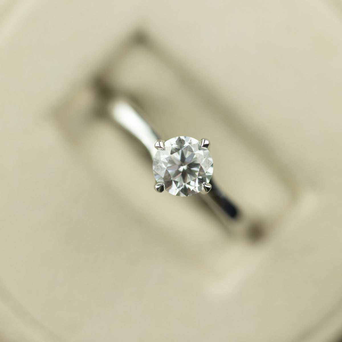 Platinum round brilliant 0.90ct GIA diamond 4 claw twist set solitaire ring