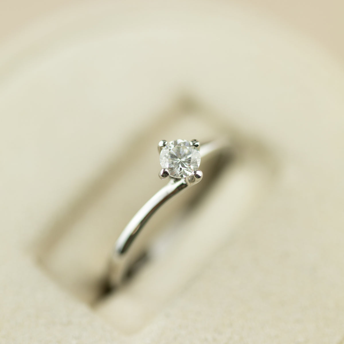 Platinum round brilliant 0.25ct diamond 4 claw twist set solitaire ring