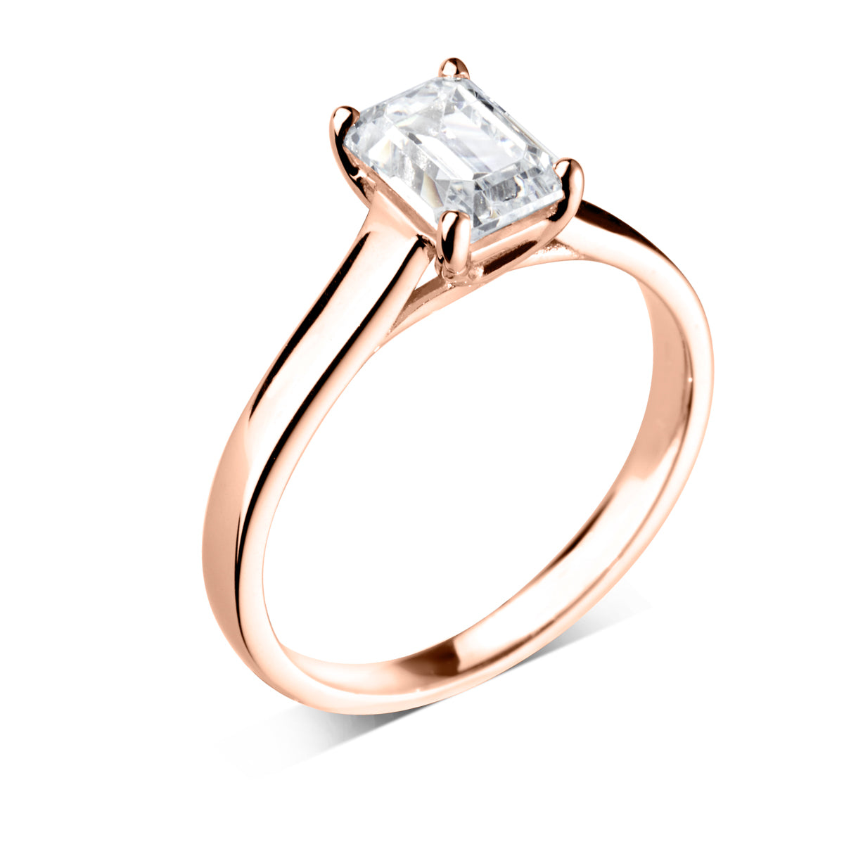 Emerald cut 4 claw diamond crossover ring