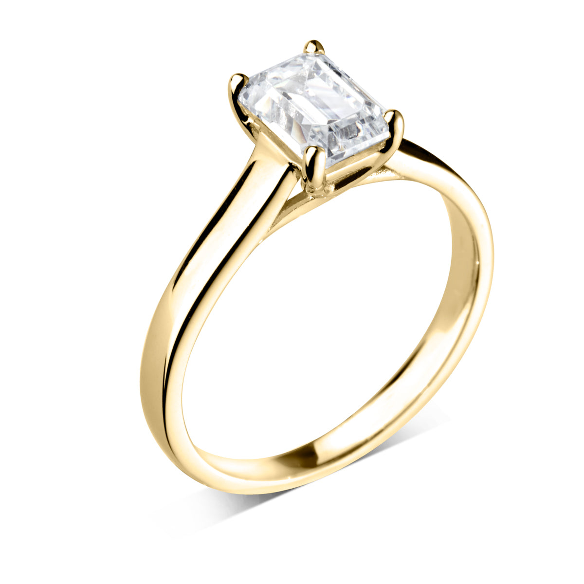 Emerald cut 4 claw diamond crossover ring