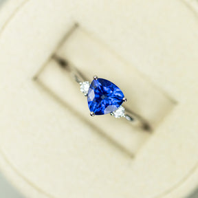 18ct White Gold Trilliant Cut Tanzanite Ring With Diamond Accents Available at RR Jewellers Yarm