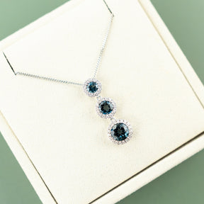 9 Karat White Gold London Blue Drop Halo Pendant