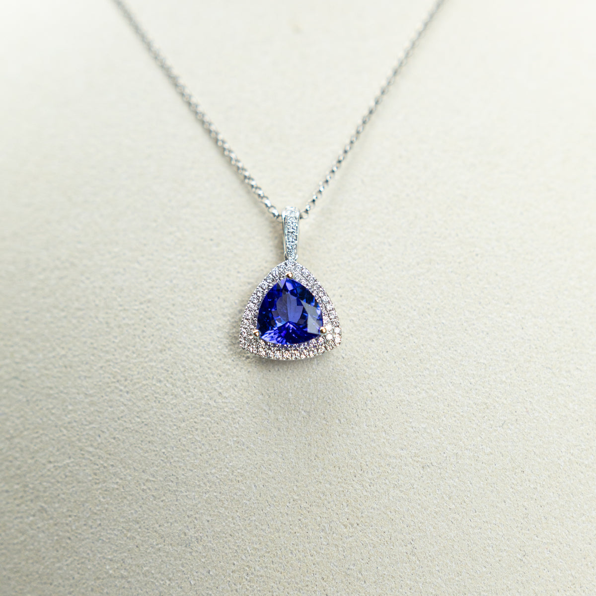 18ct White Gold Trilliant Cut Tanzanite And Diamond Double Halo Pendant At RR Jewellers Yarm