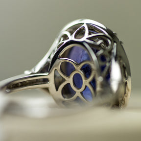 18ct White Gold Oval Tanzanite Halo Ring With Diamond Set Band