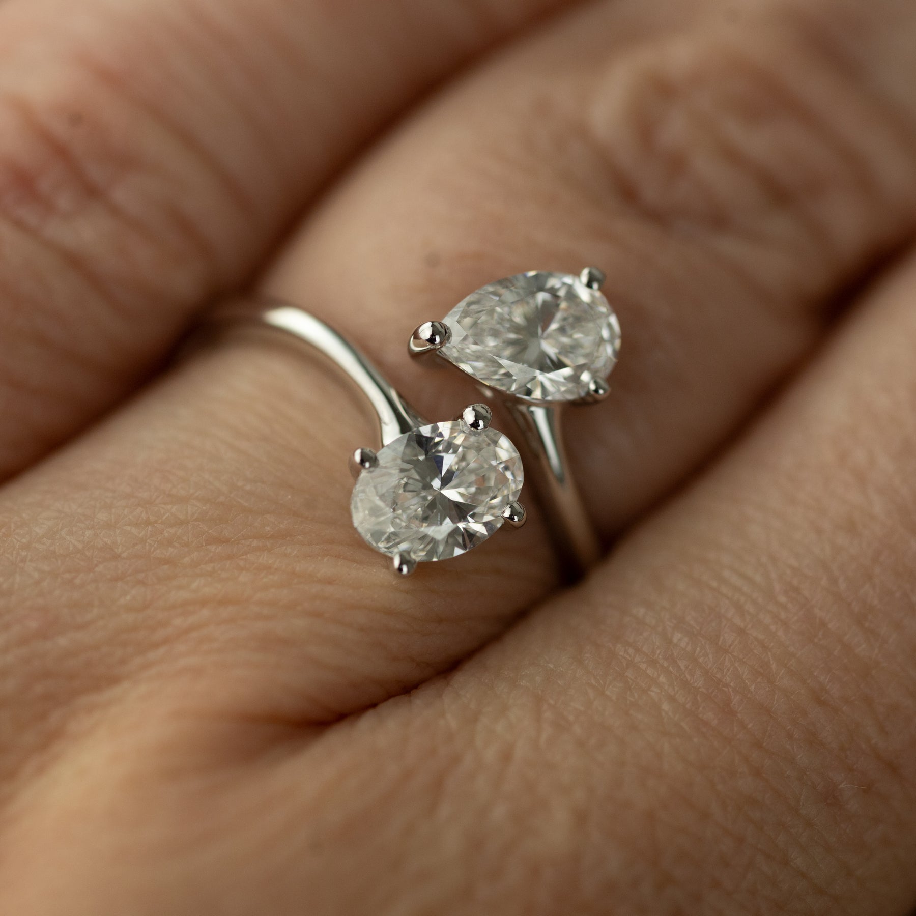 9ct white gold pear & oval cut diamond bypass ring