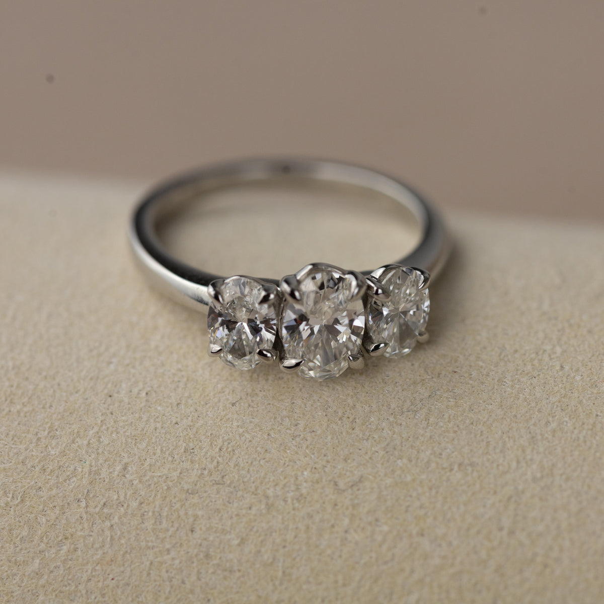 Platinum graduated 1.50ct oval cut trilogy ring