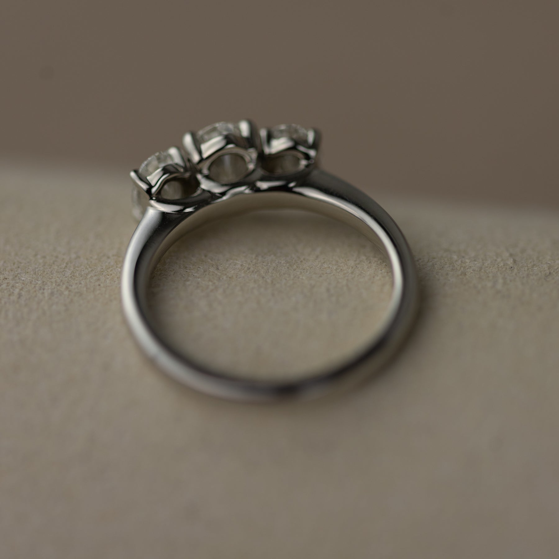 Platinum graduated 1.50ct oval cut trilogy ring