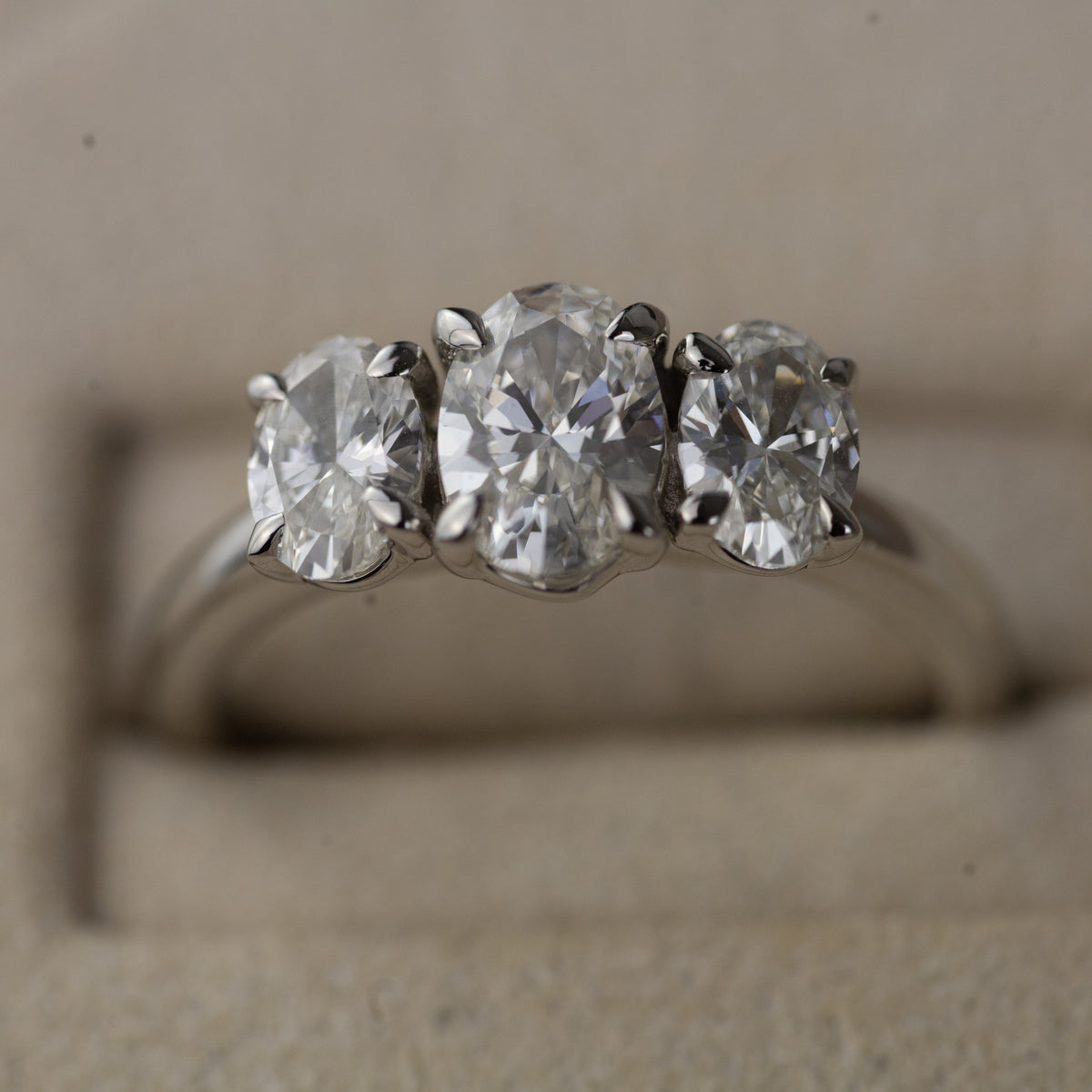 Platinum graduated 1.50ct oval cut trilogy ring