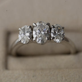 Platinum graduated 1.50ct oval cut trilogy ring