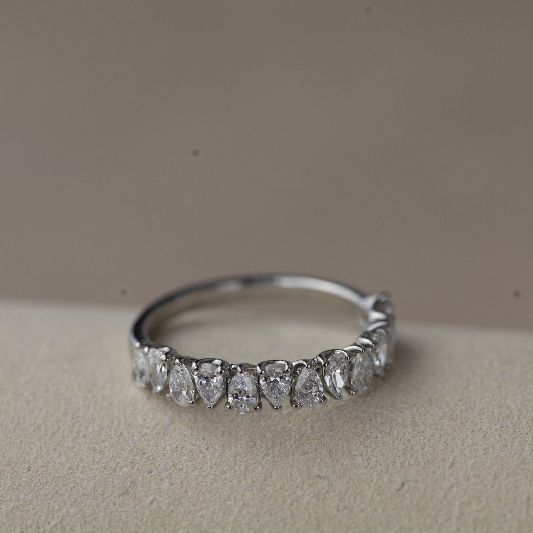 Platinum pear cut claw set eternity ring
