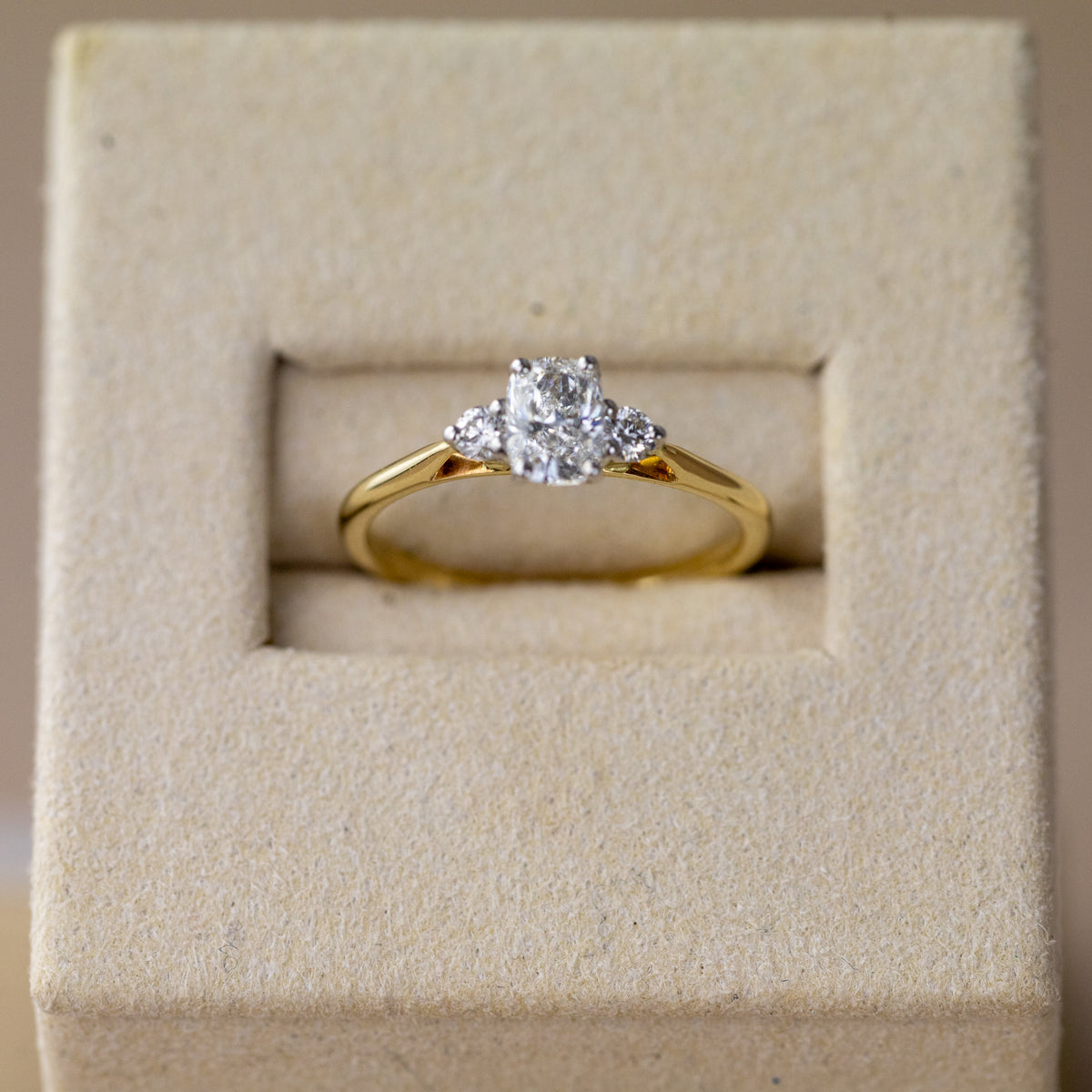 9ct yellow gold cushion cut 0.62ct diamond trilogy ring