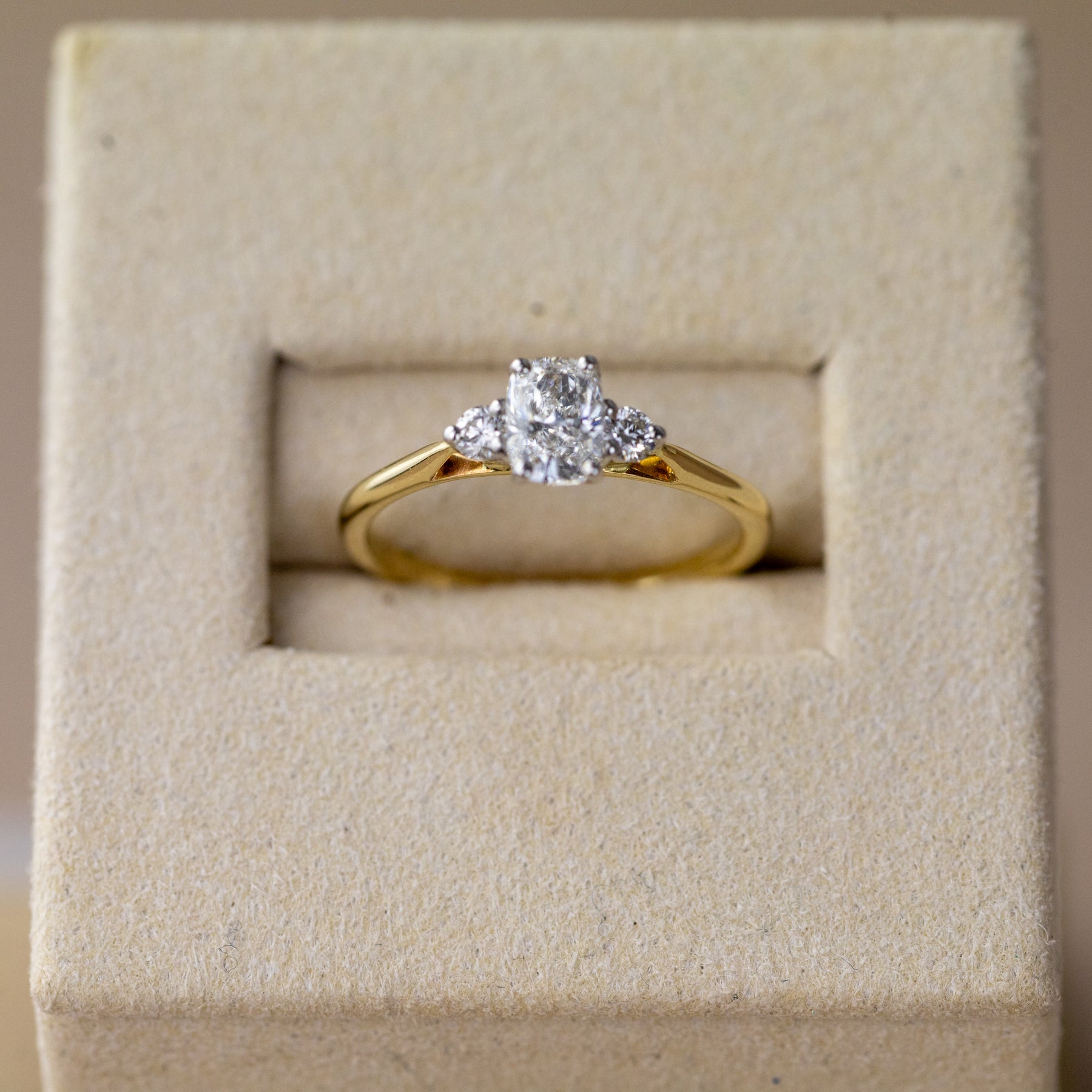 9ct yellow gold cushion cut 0.62ct diamond trilogy ring