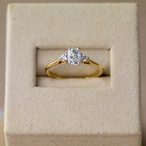 9ct yellow gold cushion cut 0.62ct diamond trilogy ring