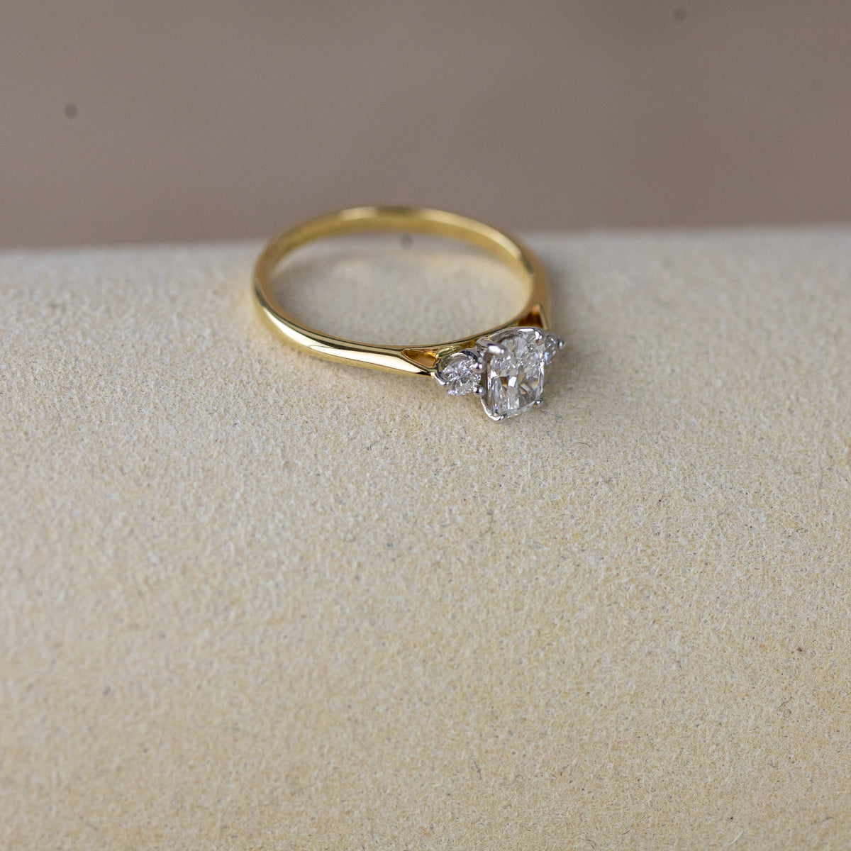 9ct yellow gold cushion cut 0.62ct diamond trilogy ring