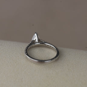 Platinum pear cut 0.70ct solitaire ring with diamond set shoulders