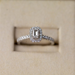 Platinum 0.33ct emerald cut lab diamond halo ring with diamond shoulders