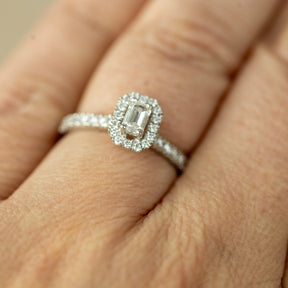 Platinum 0.33ct emerald cut lab diamond halo ring with diamond shoulders