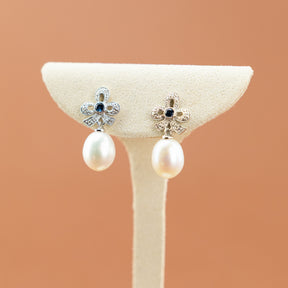 Freshwater Pearl & Sapphire Bow Earring in 9 Karat White Gold at RR Jewellers UK